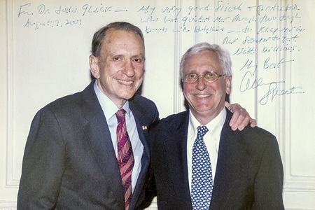 Late Pennsylvania Senator Arlen Specter stands with his arm around his oncologist, John Glick, MD, emeritus professor, in a snapshot with a grateful message from Sen. Specter scrawled on top.